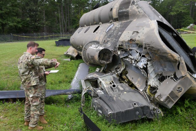 Soldiers attending the Army Mishap Investigation Course at Fort Rucker, Ala. inspects aircraft components from destroyed CH-47 Chinook helicopter at the U.S. Army Combat Readiness Center&#39;s Crash Dynamic Laboratory. The lab features distinct recreations of various mishap scenes involving Army rotary-wing aircraft, military vehicles, unmanned aircraft systems and private motor vehicles. Trainees follow the rigorous procedures of Army mishap investigations with a
goal of understanding causes to prevent similar incidents in the future.
