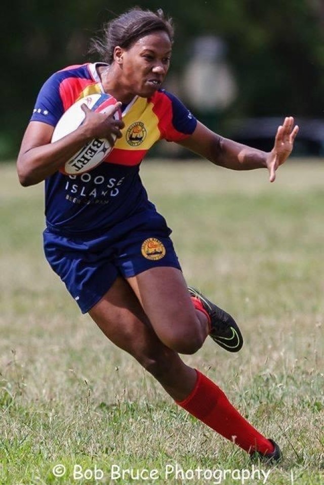 Army 2nd Lt. Gabrielle Cole of the Illinois National Guard runs across the pitch during a recreational game of rugby.