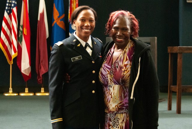 Army 2nd Lt. Gabrielle Cole of the Illinois National Guard poses with her mother after completing U.S. Army Flight School at Fort Rucker, Ala., March 24, 2022.