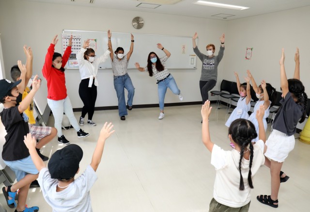 Japanese students play Simon Says during an outreach event at the Sagamihara Shiritsu Oyama Community Center, Japan, Aug. 10, 2022. Five Soldiers assigned to the 623rd Movement Control Team played games with the students to help hone their English...