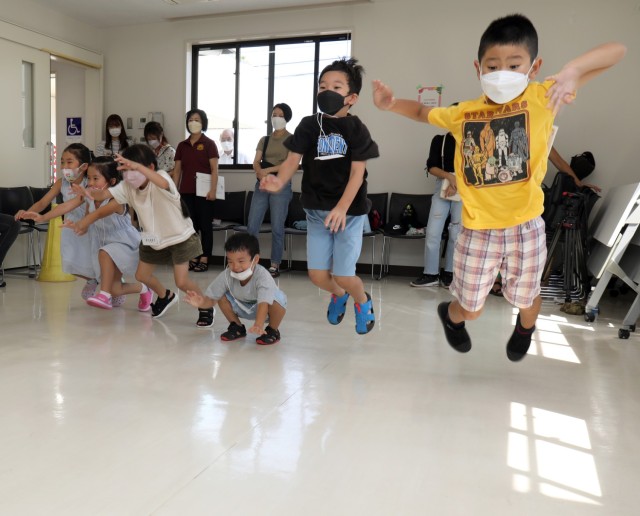 Japanese students play Red Light, Green Light during an outreach event at the Sagamihara Shiritsu Oyama Community Center, Japan, Aug. 10, 2022. Five Soldiers assigned to the 623rd Movement Control Team played games with the students to help hone...