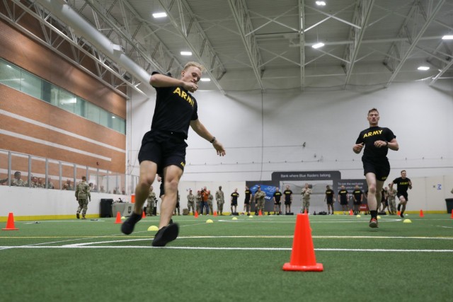 Army Spc. Daniel Reading, a Maryland National Guardsman, and Sgt. Tyler Holloway, a Wyoming National Guardsman, sprint during the 2022 Army National Guard Best Warrior Competition at Middle Tennessee State University in Murfreesboro, Tenn., July 25, 2022.