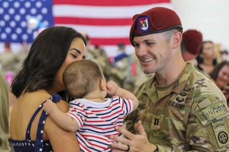 A Soldier reunites with family at Fort Bragg, N.C., July 12, 2022, after returning home from deployment.