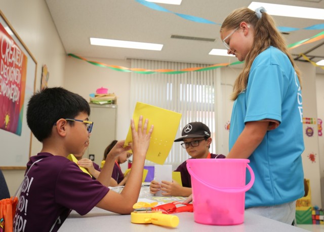 Children work on an arts and crafts project during a Vacation Bible School at Camp Zama, Japan, Aug. 9, 2022. More than 140 children from the Army community participated in the program, which provided children the chance to play with friends while learning a variety of religious lessons.