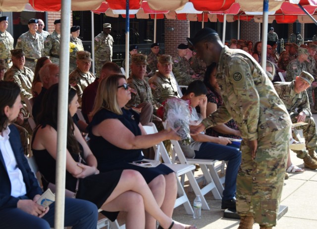 Mrs. Kokaska, wife of the outgoing commanding general of the 102nd Training Division, is given red roses during the division&#39;s change of command ceremony at the Maneuver Support Center of Excellence Plaza at Fort Leonard Wood, Missouri, Aug. 13, 2022. The roses signify the bonds of loyalty and affection between the command and the commander&#39;s spouse.