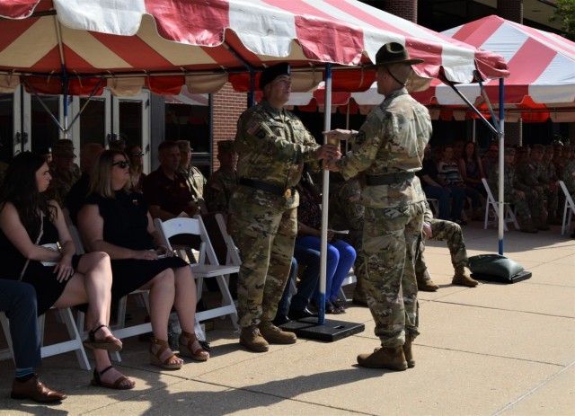 Brig. Gen. James J. Kokaska Jr., outgoing commanding general of the 102nd Training Division, receives the last mortar shell fired during the division&#39;s change of command ceremony at the Maneuver Support Center of Excellence Plaza at Fort Leonard Wood, Missouri, Aug. 13, 2022. 