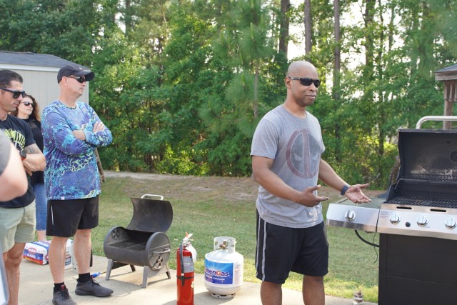 Master Sergeant Melvin Reece teaches grill safety during SATMO&#39;s annual Safety Stand Down May 20, 2022.  