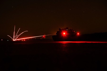 Soldiers assigned to the 1st Armored Brigade Combat Team, 3rd Infantry Division conduct a night live-fire exercise with M1A2 Abrams main battle tanks at the 7th Army Training Command&#39;s Grafenwoehr Training Area, Germany, March 3, 2022.