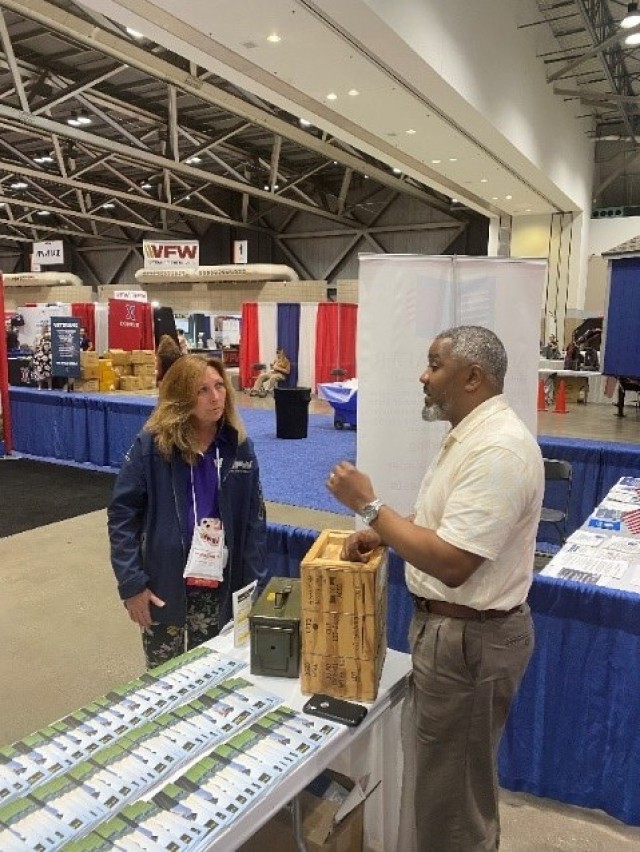 Telacy Biles discusses ceremonial ammunition processes with Tammie Gniotczynski from VFW National Headquarters during the 122d annual VFW National Convention. 