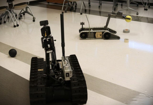 Two Small Unmanned Ground Systems - iRobot 310 and Talon – being used during a hands-on demonstration at a technology showcase for incoming P-Tech students at the Mallette Training Facility Aug. 9, 2022.