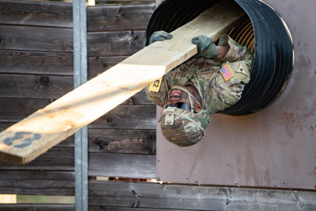 U.S. Army Sgt. Jacquez McNair, assigned to 21st Theater Sustainment Command, navigates an obstacle during the final event of the 2022 U.S. Army Europe and Africa Best Squad Competition at Grafenwoehr Training Area, Germany, Aug. 12, 2022.
