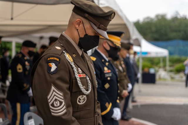 U.S. Army Garrison Daegu Senior Enlisted Leader Command Sgt. Maj. Jonathon J. Blue bows his head during a moment of silence at a wreath laying ceremony in Waegwan, Republic of Korea, August 17, 2022. The ceremony was held in memory of the forty-one U.S. Army Soldiers who were murdered by North Korean troops at Hill 303 on August 17, 1950.
