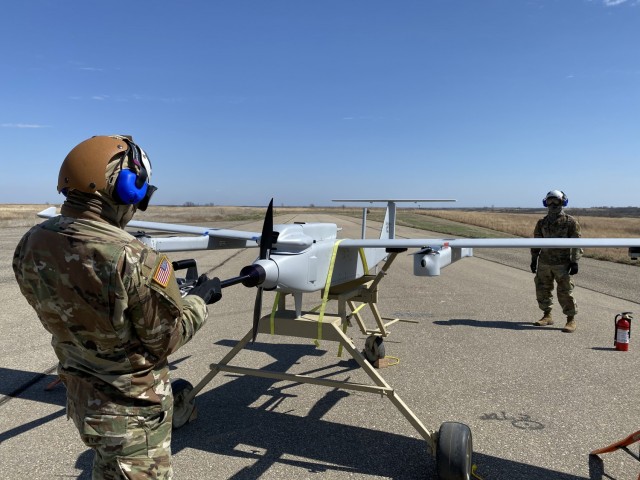 Spc. Christopher McCoy assigned to 1st Engineer Battalion, 1st Infantry Division, conducts an engine start on the JUMP 20 prior to a launch during the FTUAS capabilities assessment at Fort Riley, Kansas, April 8, 2020