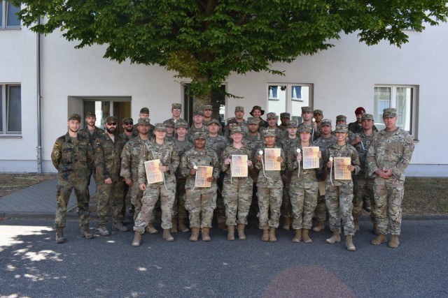 In the spirit of marksmanship training and partnership, the 6. Feldjaeger Regiment 3 from Bruchsal, Germany, hosted Public Health Command Europe soldiers in a Schutzenschnur, German marksmanship, shooting event Aug. 9.