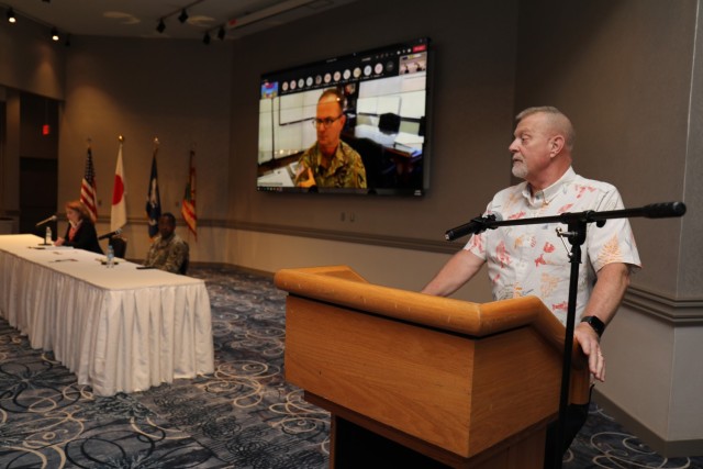 Jeff Zentz, right, chief of Work Force Development, answers a question during an employee town hall at the Camp Zama Community Club, Japan, Aug. 19, 2022. Nearly 300 employees attended the town hall virtually or in-person as leadership addressed concerns and shared updates on programs and services available to the workforce.