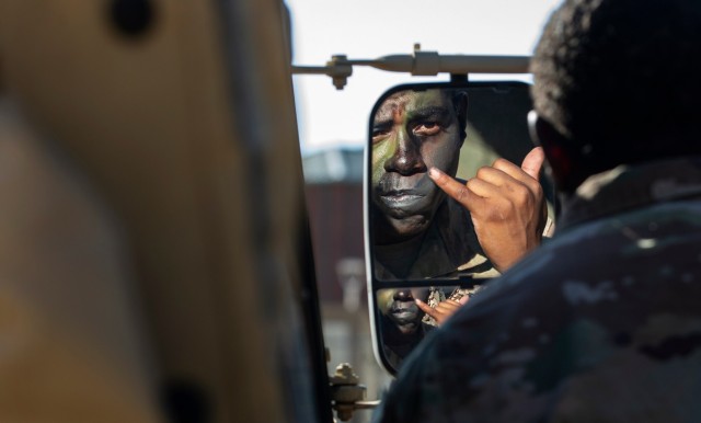 Spc. Brandon Charles Brown, an infantryman assigned to 4th Battalion, 9th Infantry Regiment,1st Stryker Brigade Combat Team, 4th Infantry Division, applies camouflage paint onto his face during the first morning of Command Post Exercise II (CPX II), Aug. 19, 2022, at the Mission Training Center, Fort Carson, Colorado. CPX II was a scenario-based exercise designed to prepare the division staff for an upcoming large-scale field operation later this year.