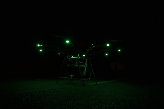 A  drone lit up in green during a nighttime exercise at White Sands Missile Range, New Mexico.