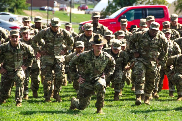 Staff Sgt. Robert Schofield leads new trainees in lunging toward the finish line during the final event of the Foundry I Tuesday at Company E, 701st Military Police Battalion. Foundry I will replace the long-standing “shark attack” as Echo Company’s reception and integration procedure. 
