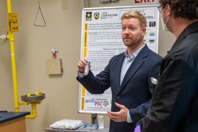 Army researcher Dr. Matthew Coppock briefs  a group of scientists and policymakers from the White House Office of Science and Technology Policy, at the Adelphi Laboratory Center on Aug. 23.