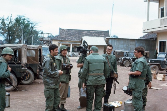 Famed CBS newsman Walter Cronkite, wearing helmet with members of his crew, visits Hue in February 1968. 