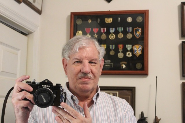 Pat Freel holds the camera he used to shoot more than 500 pictures in Vietnam from 1966-68.