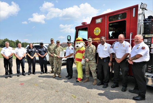 With members of the Fort Knox Fire Department and Garrison Command Sgt. Maj. William Fogle at his side Aug. 26, 2022, Col. Lance O’Bryan officially declares Oct. 9-15 Fire Prevention Week.
