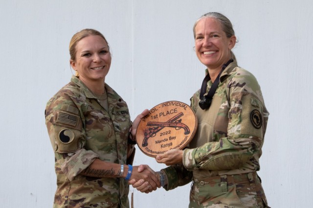 U.S. Army Sgt. Alexandra Griffeth, left, placed first in the individual pistol category in the joint-force combined arms marksmanship competition among 52 Army Guard and Air Force members assigned to Combined Joint Task Force-Horn of Africa. The competition was held July 20-25, 2022, at Camp Simba, Kenya.  (U.S. Army National Guard Photos by Sgt. Thomas Johnson)