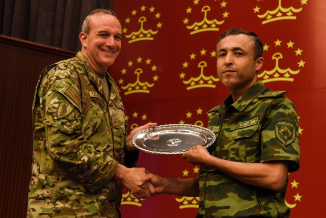 Brig. Gen. Maurizio D. Calabrese, deputy commanding general for intelligence at U.S. Central Command’s Over-the-Horizon Counterterrorism Headquarters, exchanges a gift at the close of the Regional Cooperation 22 exercise in Dushanbe, Tajikistan, Aug. 19, 2022. RC 22 is an annual, multinational U.S. Central Command-sponsored exercise conducted by U.S. forces with Central and South Asia nations. (U.S. Army National Guard photo by Sgt. 1st Class Terra C. Gatti)