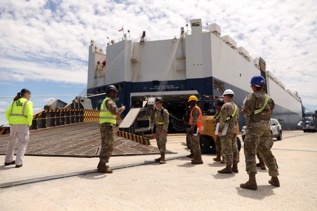 Chief Warrant Officer 2 Kevin Coleman (center), the 3rd Division Sustainment Brigade mobility officer, discusses port operations with Soldiers from
the 414th Signal Company, 258th Movement Control Team, and unit movement officers assigned to the Division Sustainment Troops Battalion, 3rd DSB, May 8 during a port to fort operation at the Joint Base Charleston Naval Weapons Station in Charleston, South Carolina. 