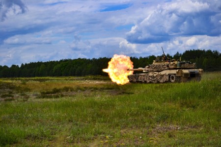 An Army M1A2 Abrams tank assigned to the 1st Battalion, 68th Armor Regiment, 3rd Armored Brigade Combat Team, 4th Infantry Division fires during a gunnery Table V exercise at Drawsko Pomorskie, Poland, June 7, 2022. The 3/4th ABCT is among other units assigned to V Corps, America’s forward deployed corps in Europe that works alongside NATO allies and regional security partners to provide combat-credible forces.