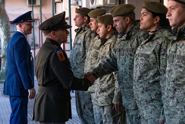 U.S. Army Maj. Gen. Francis Evon, left foreground, the Connecticut adjutant general, shakes hands with an Uruguayan Army soldier during a visit to the National Peace Operations Training School of Uruguay, or ENOPU, Montevideo, Uruguay, August 10, 2022. ENOPU is where Uruguayan military and police forces train to prepare to deploy to support U.N. peacekeeping operations. (U.S. Army photo by Sgt. Matthew Lucibello)