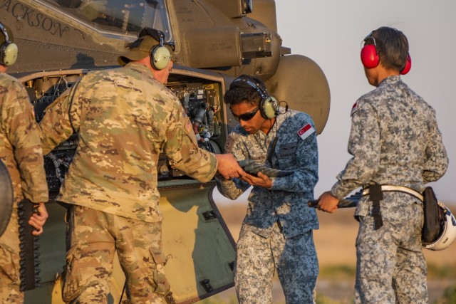 Service members from the Peace Vanguard Republic of Singapore Air Force and the Arizona Army National Guard trained together July 21-Aug. 29, 2022, at the Idaho National Guard’s Orchard Combat Training Center, completing day and night AH-64...