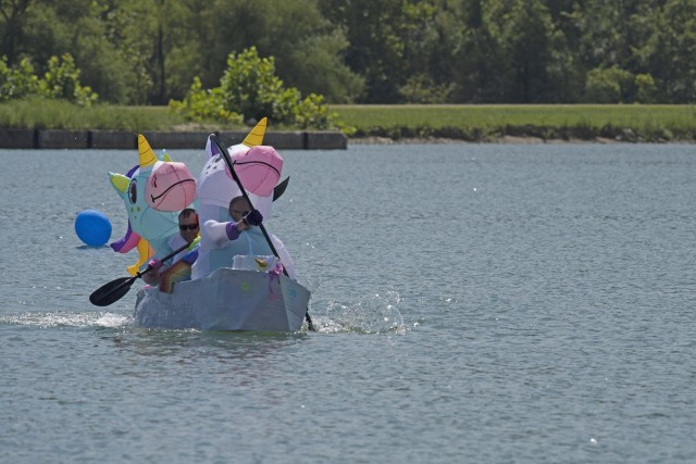 Max Saalmann and Eric Claire, also known as “The Unicorns,” paddle across the lake at Training Area 250 Saturday during Fort Leonard Wood’s annual Cardboard Boat Race event, hosted by the Directorate of Family and Morale, Welfare and Recreation. This year, 18 two-person teams entered boats in the competition, and the teams each competed in one of two divisions – adult and family – for four award categories. 