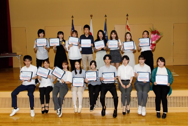 Japanese university students pose for a photo following their graduation from the summer internship program at Camp Zama, Japan, Sept. 1, 2022. This year&#39;s program had the largest participation in its nine-year history with 23 students, 11 universities and 19 workplaces participating.