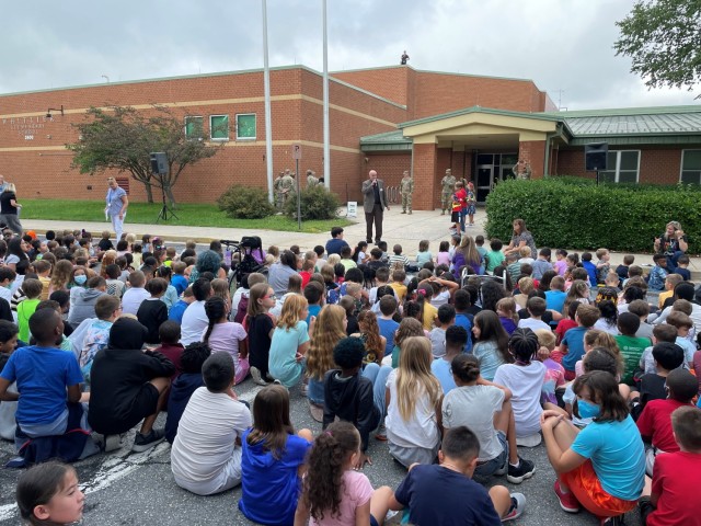 In accordance with a long-standing tradition at Fort Detrick, Garrison Command Sgt. Maj. Michael Dills and Soldiers from the post helped raise the U.S. flag on the first day of school at Whittier Elementary School. (Photos by Lanessa Hill, USAG Public Affairs)