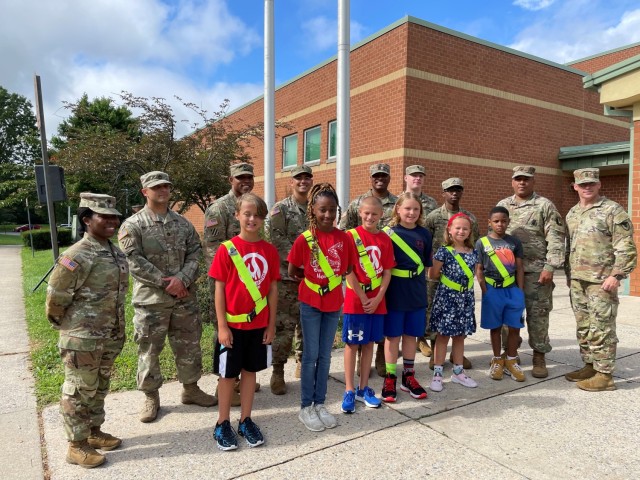 In accordance with a long-standing tradition at Fort Detrick, Garrison Command Sgt. Maj. Michael Dills and Soldiers from the post helped raise the U.S. flag on the first day of school at Whittier Elementary School.