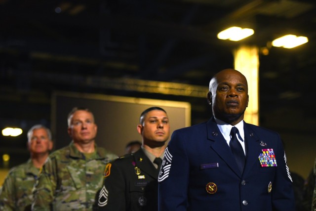 Senior Enlisted Advisor Tony Whitehead, right, the SEA to the chief of the National Guard Bureau, stands at attention during a convention in Columbus, Ohio, Aug. 29, 2022.