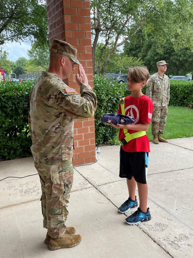 In accordance with a long-standing tradition at Fort Detrick, Garrison Command Sgt. Maj. Michael Dills and Soldiers from the post helped raise the U.S. flag on the first day of school at Whittier Elementary School. (Photos by Lanessa Hill, USAG Public Affairs)