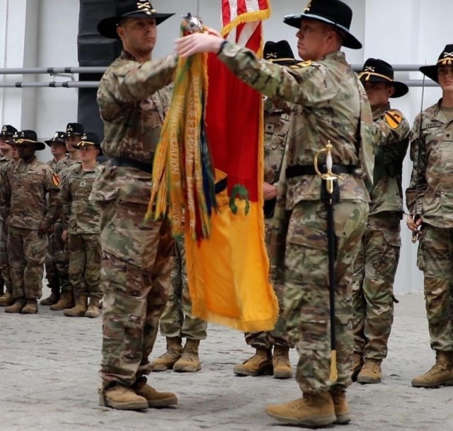 Col. John Gilliam, commander of 3rd Armored Brigade Combat Team, 1st Cavalry Division and Command Sgt. Maj. Michael Hall uncasing the brigade&#39;s colors during a ceremony on Drawsko Pomorskie training area. The 3rd Armored Brigade Combat Team is...