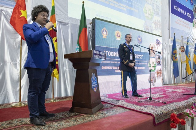 Erdenesaikhan Amarsaikhan, left, translates for Maj. Alexei Fainblout, exercise director, U.S. Army Pacific, during the opening ceremony for Gobi Wolf 2022 in Bayankhongor, Mongolia, Sept. 5. Gobi Wolf is a disaster response exercise part of the Pacific Resilience Disaster Response Exercise and Exchange program, which focuses on interagency coordination and foreign humanitarian assistance. Participating countries also include Bangladesh, Nepal, Sri Lanka, Thailand, the United Kingdom and Vietnam. 