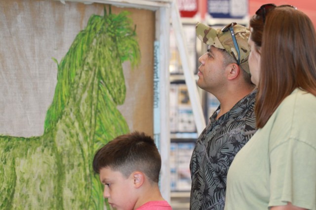 Painting on a cross-country trek stops by JBLM