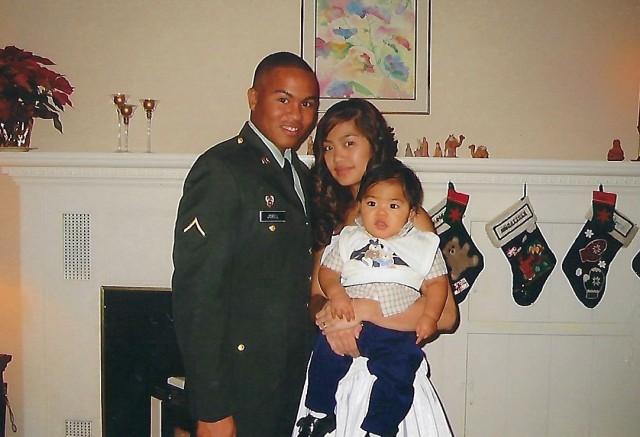 Pvt. Keith Joell, now a chief warrant officer two assigned to U.S. Army Japan, poses for a photo with his wife, Windy, and their son, Ke’Shaun, while attending advanced individual training. Joell administered the oath of enlistment to Ke’Shaun during a ceremony at the Camp Zama recruiting office, July 20, 2022.