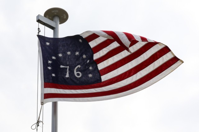 CAMP NOTHING HILL, Kosovo - The flag of Spc. Jacob Holley’s grandfather flies over Camp Nothing Hill, Kosovo on August 31, 2022. Holley’s Bennington flag features 13 stars and 13 stripes to symbolize the 13 American colonies in rebellion against Great Britain. 