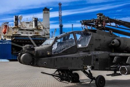 The first AH-64 Apache helicopter is discharged from the commercial cargo vessel, ARC Endurance, at the Port of Esbjerg, Denmark on Aug 22, 2022. The 598th Transportation Brigade (SDDC) and 21st Theater Sustainment Command work in conjunction to transport the 1st Armored Division’s Combat Aviation Brigade from Fort Bliss, Texas through the port to forward operating locations in Europe for Atlantic Resolve.