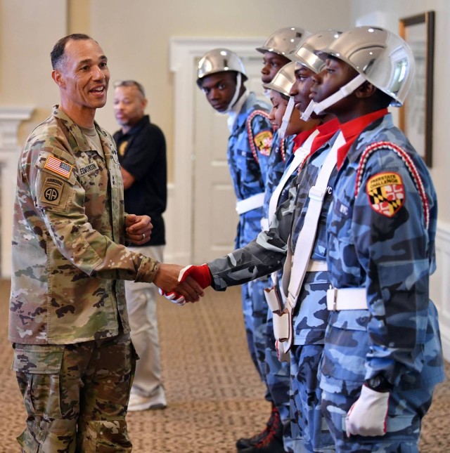 Maj. Gen. Robert Edmonson II, commanding general for the U.S. Army Communications-Electronics Command and APG senior commander, shakes hands with Freestate ChalleNGe Academy cadets at Top of the Bay after a drill team introduction for APG’s Immersion Day Aug. 23, 2022.