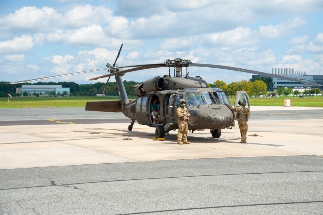 Local, state and federal community leaders take an aerial tour in a UH-60 Black Hawk helicopter as a special treat for APG’s Immersion Day Aug. 22, 2022. 
