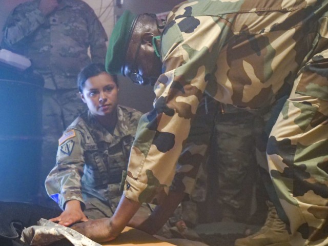 Medical professionals from the Niger Armed Forces observe training simulations at the Medical Simulation Training Center with Indiana Army and Air National Guard medical professionals during a State Partnership Program exchange at Camp Atterbury, Indiana, in July 2022.