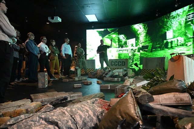 Dan Boehm, field medical education specialist for the U.S. Army Medical Research Institute for Chemical Defense, demonstrates how the Wide Angle Virtual Environment training center works for guests during APG’s Immersion Day Aug. 23, 2022. 