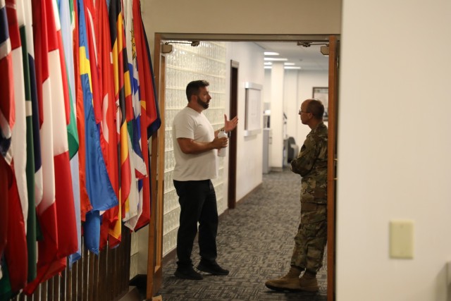 (From right) U.S. Army Security Assistance Command Chaplain Col. Jonathan Fowler speaks with Chris Cuomo, a G8 Financial Management Specialist at USASAC&#39;s New Cumberland, Pennsylvania headquarters July 28, 2022. The two discussed their shared military experiences and how it helped shape Cuomo&#39;s desire to stay associated with the military and work for USASAC. To find out how you can find purpose and passion in the Army, obtain a $50,000 signing bonus, or for information on how an Army career can help you achieve your life goals, visit https://www.goarmy.com/.