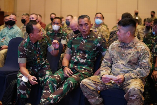 Air Force Col. Christopher Cullen, right, Hawaii Air National Guard logistics officer, discusses the schedule for the first day of Exercise Gema Bhakti 2022, Sept. 9, 2022, Jakarta, Indonesia. Gema Bhakti 22 is a USINDOPACOM Joint Exercise Program to increase interoperability and enhance regional stability and security through bilateral and multilateral partnerships. (U.S. Air Force Photo by Master Sgt. Andrew Jackson)